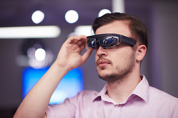 Image showing man using virtual reality gadget computer glasses