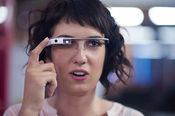 Image showing woman using virtual reality gadget computer glasses