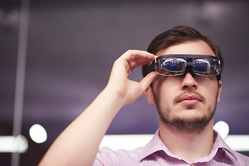 Image showing man using virtual reality gadget computer glasses