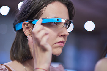 Image showing woman using virtual reality gadget computer glasses