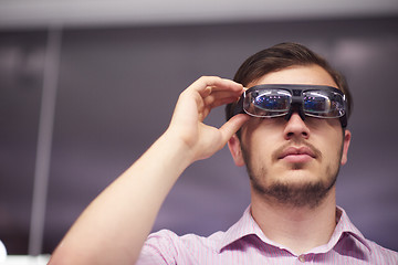 Image showing man using virtual reality gadget computer glasses