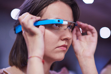 Image showing woman using virtual reality gadget computer glasses