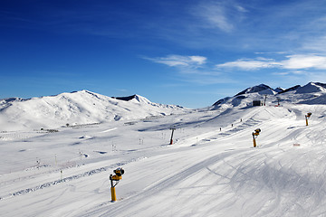 Image showing Ski slope with snowmaking at sun day