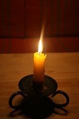 Image showing Burning candle on a table