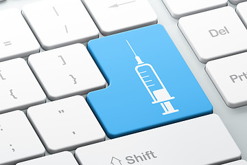 Image showing Healthcare concept: Syringe on computer keyboard background