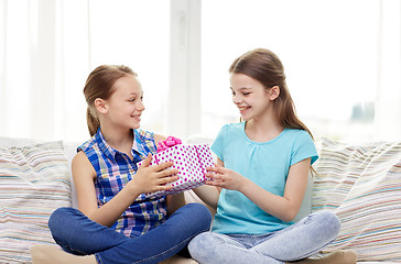 Image showing happy little girls with birthday present at home