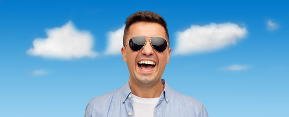 Image showing face of smiling man in shirt and sunglasses