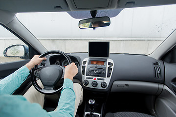 Image showing close up of young man with tablet pc driving car