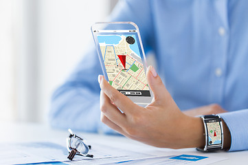 Image showing hand with navigator map on smart phone and watch