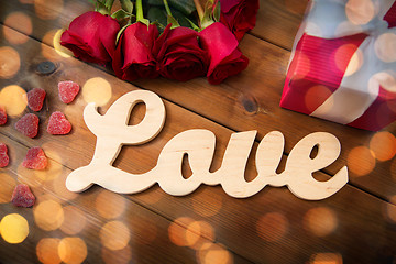 Image showing close up of word love, red roses and gift box