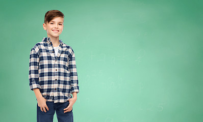 Image showing smiling boy in checkered shirt and jeans