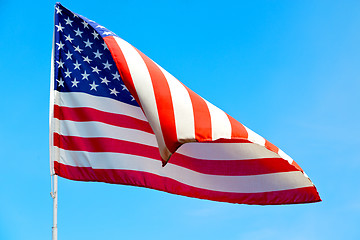 Image showing usa waving flag in the blue sky 
