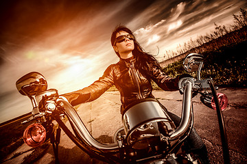 Image showing Biker girl on a motorcycle