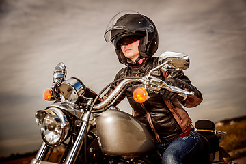 Image showing Biker girl on a motorcycle