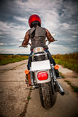 Image showing Biker girl on a motorcycle