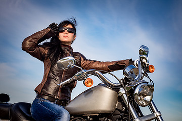 Image showing Biker girl on a motorcycle