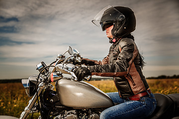 Image showing Biker girl on a motorcycle