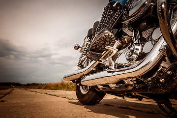 Image showing Biker girl riding on a motorcycle