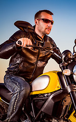 Image showing Biker on a motorcycle