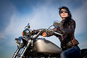 Image showing Biker girl on a motorcycle