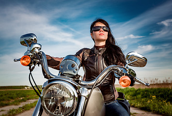 Image showing Biker girl on a motorcycle