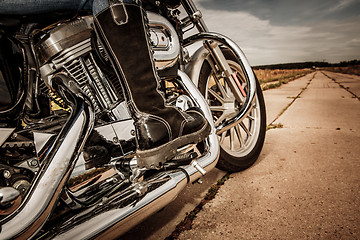 Image showing Biker girl riding on a motorcycle