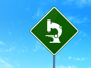 Image showing Science concept: Microscope on road sign background