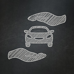 Image showing Insurance concept: Car And Palm on chalkboard background