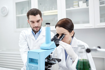 Image showing young scientists making test or research in lab