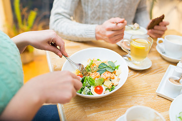 Image showing close up friends having dinner at restaurant