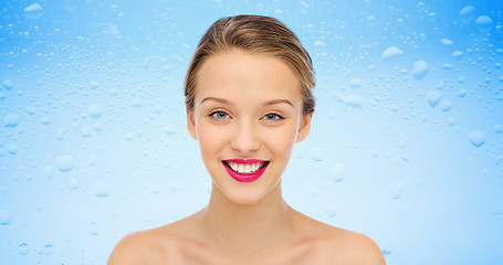 Image showing smiling young woman face and shoulders