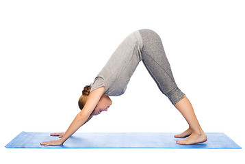 Image showing woman making yoga dog pose on mat