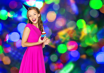 Image showing happy woman or teen girl with birthday cupcake