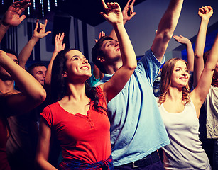 Image showing smiling friends at concert in club