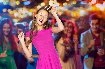 Image showing happy young woman in princess crown at night club