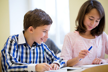 Image showing group of school kids writing test in classroom