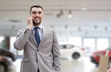 Image showing smiling businessman talking on smartphone