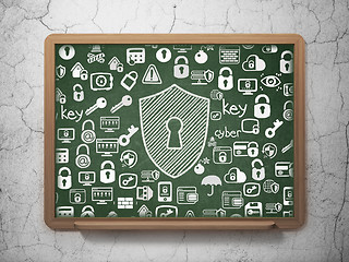 Image showing Protection concept: Shield With Keyhole on School Board background