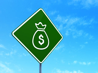 Image showing Currency concept: Money Bag on road sign background