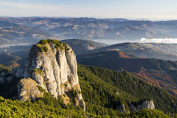 Image showing Rocky peak and autumn forest