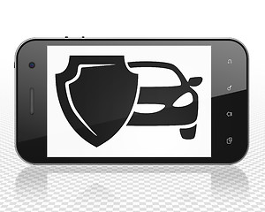 Image showing Insurance concept: Smartphone with Car And Shield on display