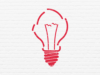 Image showing Finance concept: Light Bulb on wall background