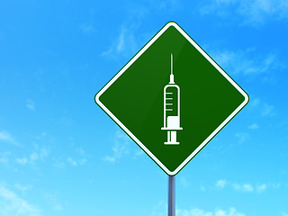 Image showing Healthcare concept: Syringe on road sign background