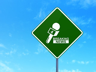 Image showing News concept: Breaking News And Microphone on road sign background