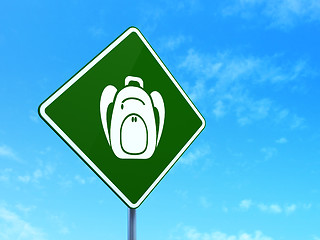 Image showing Tourism concept: Backpack on road sign background