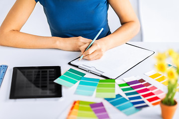 Image showing woman working with color samples for selection