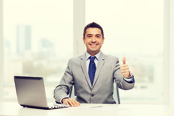 Image showing businessman working with laptop in office