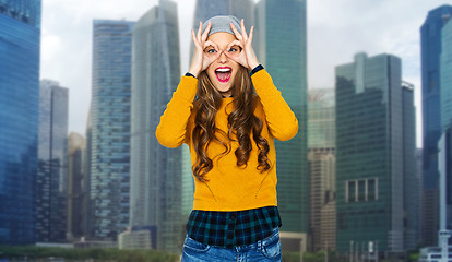 Image showing happy young woman or teen having fun over city