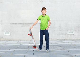 Image showing happy boy with skateboard