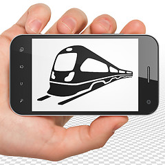 Image showing Tourism concept: Hand Holding Smartphone with Train on display